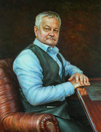 Portrait of a man in a chair at the table 