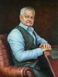 Portrait of a man in a chair at the table 